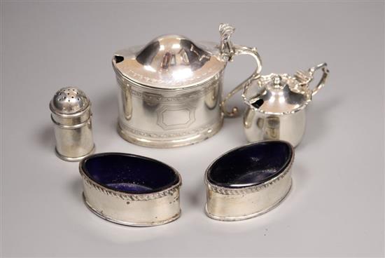 An Edwardian silver oval mustard and four other small silver condiments.